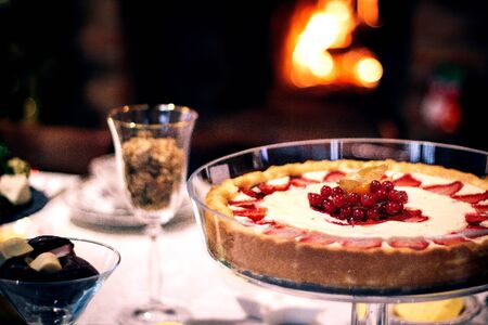 cake topped with berries and strawberriesの写真素材
