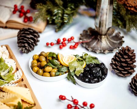 cheese plate with olive picklesの写真素材