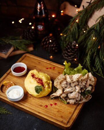chicken in cream and flapjack with potato mashの写真素材