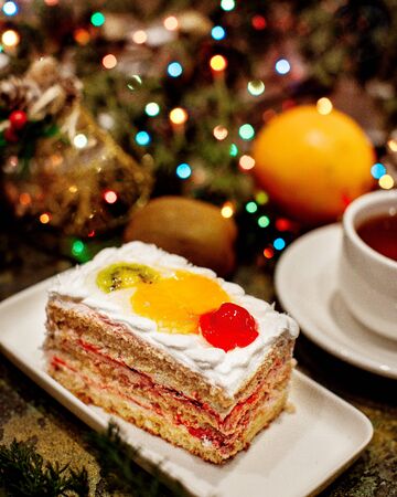 creamy dessert with various fruits on topの写真素材