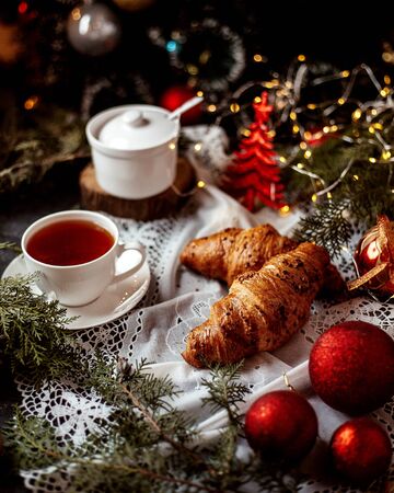 croissants with cup of black teaの写真素材