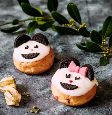 donuts with cream and oreo cookiesの写真素材