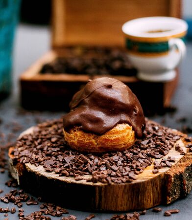 eclair topped with melted chocolateの写真素材