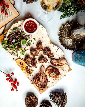 fried meat pieces with herbs and onionsの写真素材