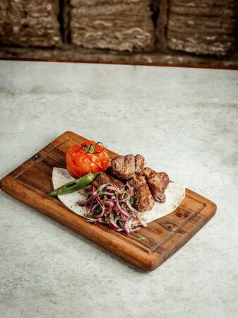 fried meat pieces with sliced onionの写真素材