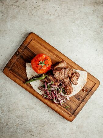 fried meat pieces with vegetablesの写真素材