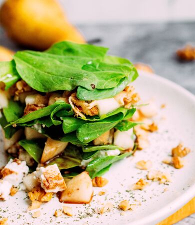 fried potato with walnuts and herbsの写真素材