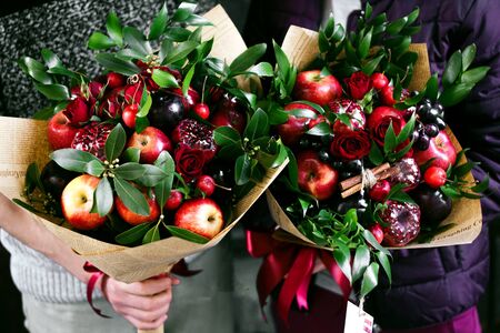 fruit bouquet with various fruits and flowersの写真素材