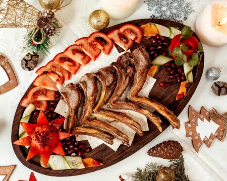 fried ribs with sliced tomatoの写真素材