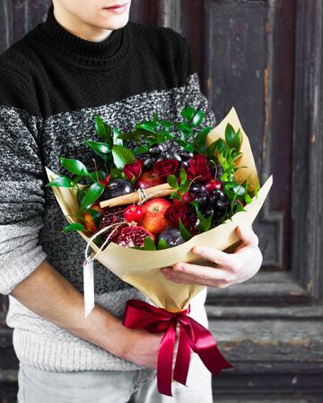 fruit bouqet with mixed fruits and flowersの写真素材