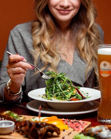 herbal salad with glass of beerの写真素材