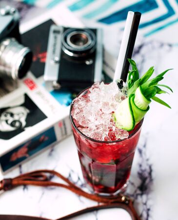 juice with crushed ice and sliced cucumber on topの写真素材