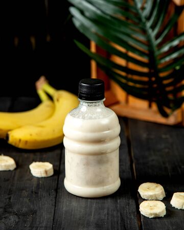 milkshake with bananas in bottleの写真素材