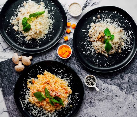 rice and mushrooms with cheese on topの写真素材