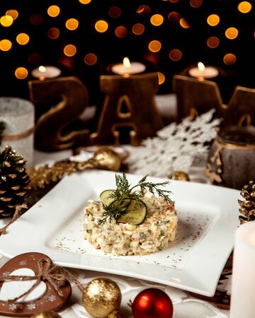 russian salad with sliced cucumberの写真素材