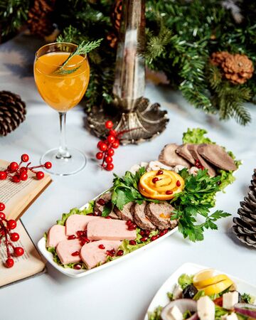 sliced ham and meat with orange juiceの写真素材