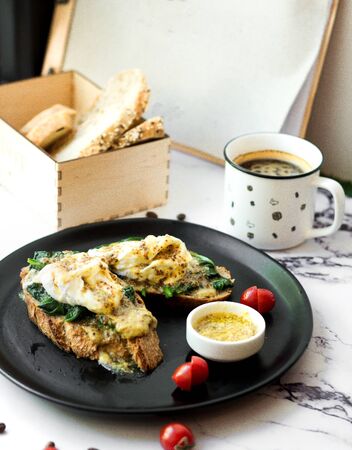 sour cream with herbs on bread and coffeeの写真素材