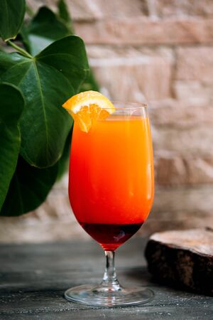 tropical juice with lemon slice on topの写真素材