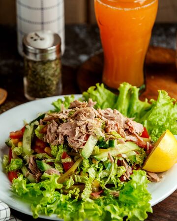 tuna salad and glass of juiceの写真素材