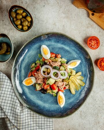 tuna salad with sliced eggs and picklesの写真素材