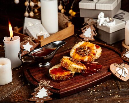sliced pineapple topped with syrup with chocolate heartの写真素材