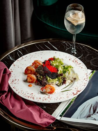 vegetable salad with caviar and shrimpsの写真素材