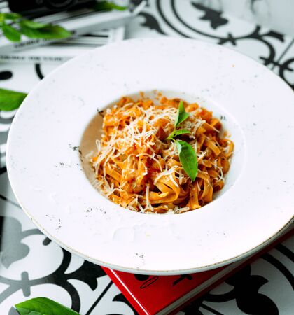 tomato pasta with chopped cheeseの写真素材