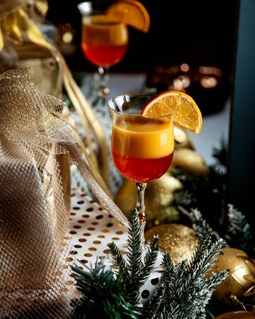 tropic juice with orange slice on topの写真素材