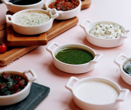 various salads and soups on the tableの写真素材