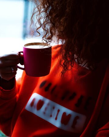 a cup of coffee in pink cupの写真素材