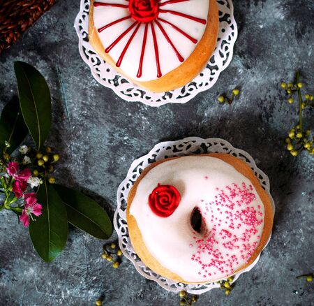 a pair of donuts with painting on topの写真素材