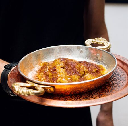 a person holding fried eggsの写真素材