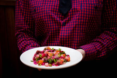 a person holds vegetable saladの写真素材