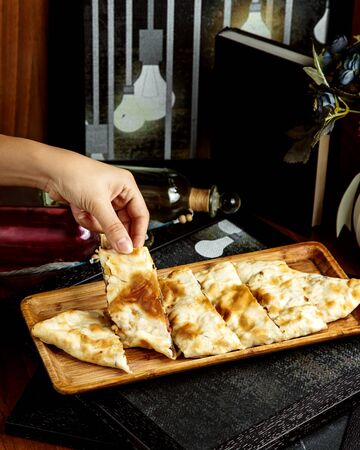 meat pide on wooden boardの写真素材