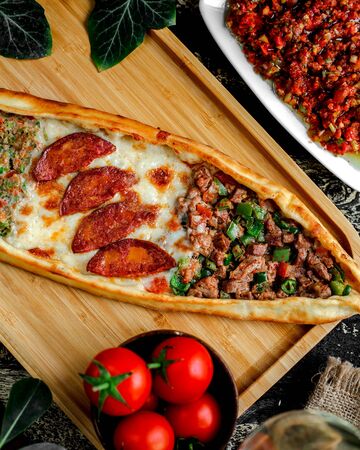 pide with meat sausage and cheese top viewの写真素材