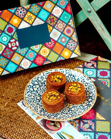 turkish dessert of kadaif rolls with pistachioの写真素材