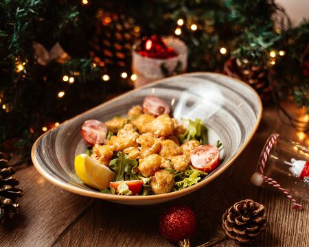 vegetable salad with crispy fried chicken piecesの写真素材