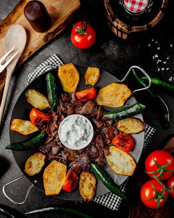 top view of lamb kebab with potato pepper tomatoの写真素材