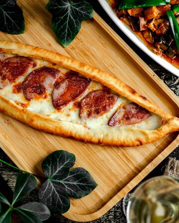 top view of pepperoni pide turkish pizza with cheeseの写真素材
