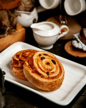 two pastry rolls with raisinsの写真素材