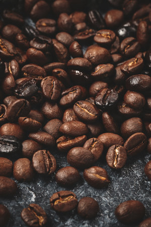 close up view of coffee seeds on dark surface cocoa grain groupの写真素材