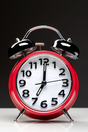 front view of red clocks on white surface time house family coffeeの写真素材