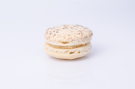 colorful macarons isolated on whiteの写真素材