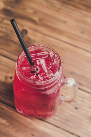 Strawberry italian soda on wood tableの写真素材