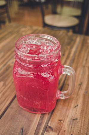 Strawberry italian soda on wood tableの写真素材