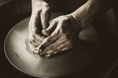 Artisan hands making clay potの写真素材