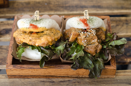 Delicious burgers bun with beef, tomato, cheese and lettuceの写真素材