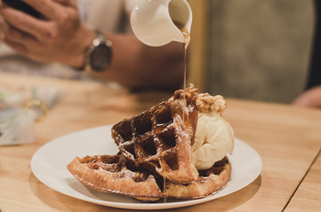 waffles with vanilla ice cream. Topped with honeyの写真素材