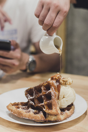 waffles with vanilla ice cream. Topped with honeyの写真素材