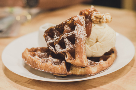 waffles with vanilla ice cream. Topped with honeyの写真素材